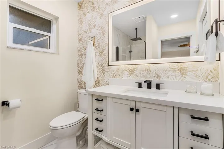 Bathroom featuring toilet and vanity