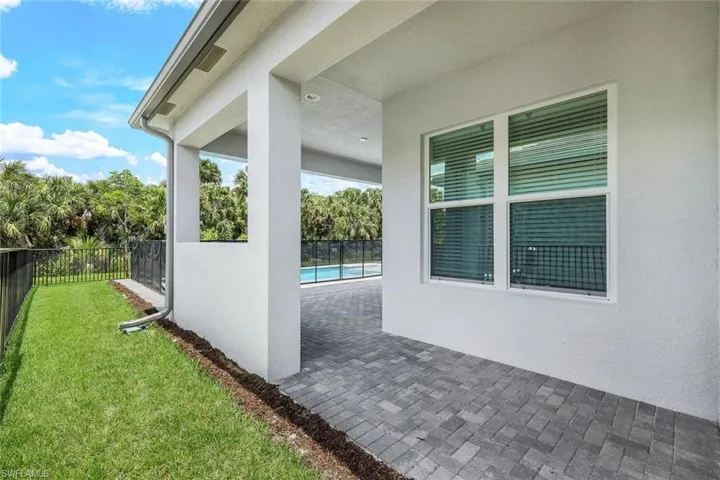 View of patio / terrace with a fenced in pool