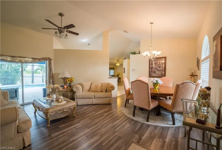 Front Living Room w/dark vinyl flooring & ceiling fan