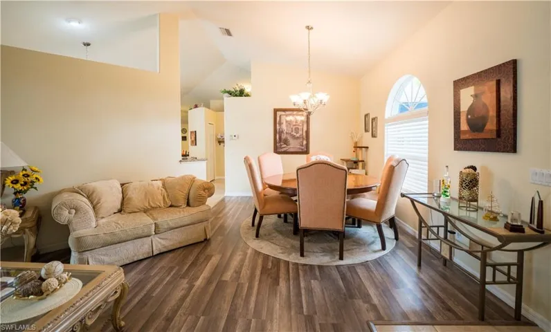 Front Living Room w/dark vinyl flooring & ceiling fan