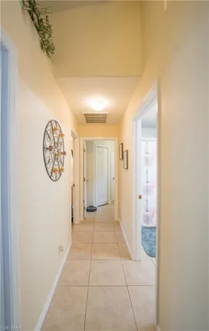Hallway to 2nd & 3rd bedrooms, 2nd bathroom, laundry room