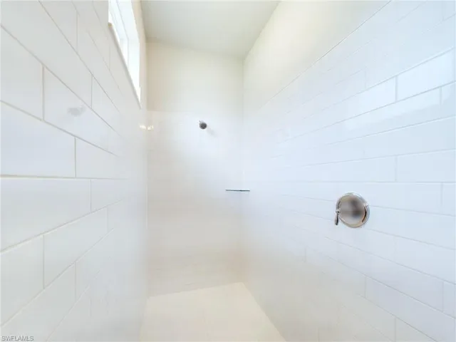 Bathroom featuring tiled shower