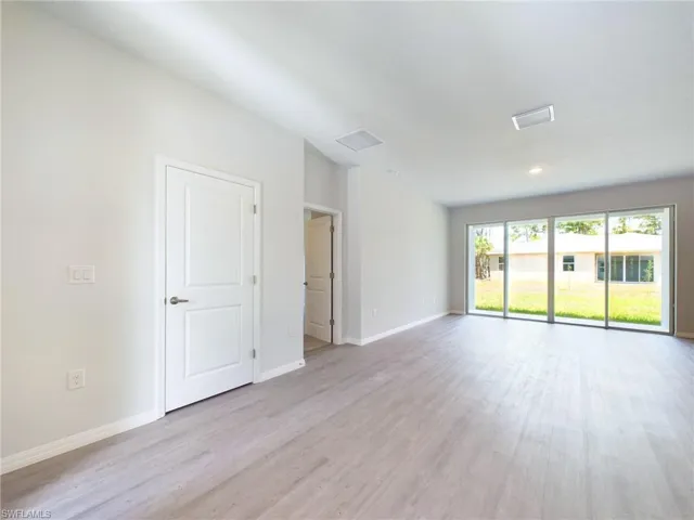 Empty room featuring light hardwood / wood-style flooring
