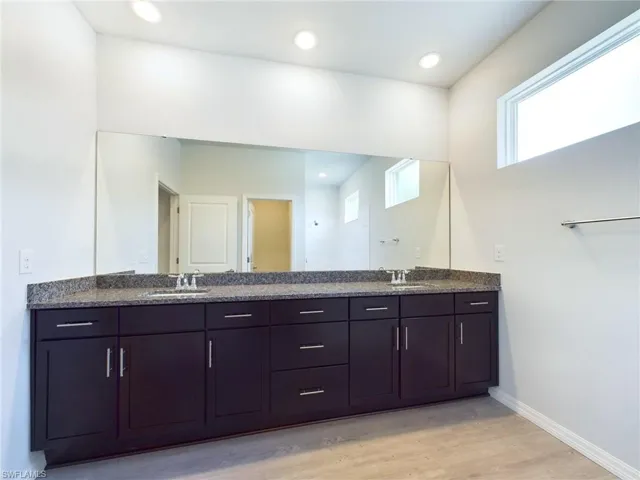 Bathroom with vanity and hardwood / wood-style flooring