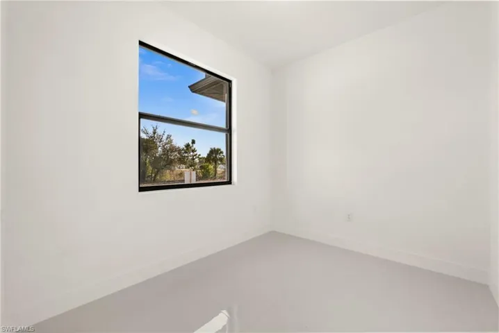 Unfurnished room with baseboards