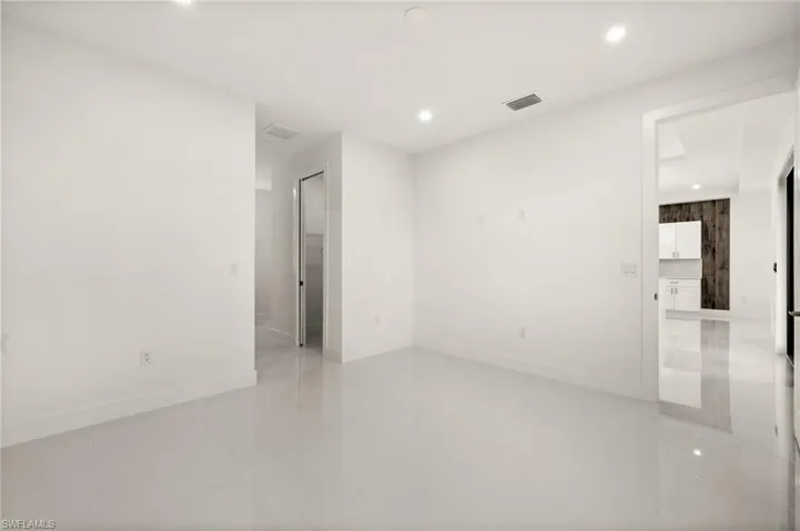 Unfurnished room featuring recessed lighting and light tile patterned floors