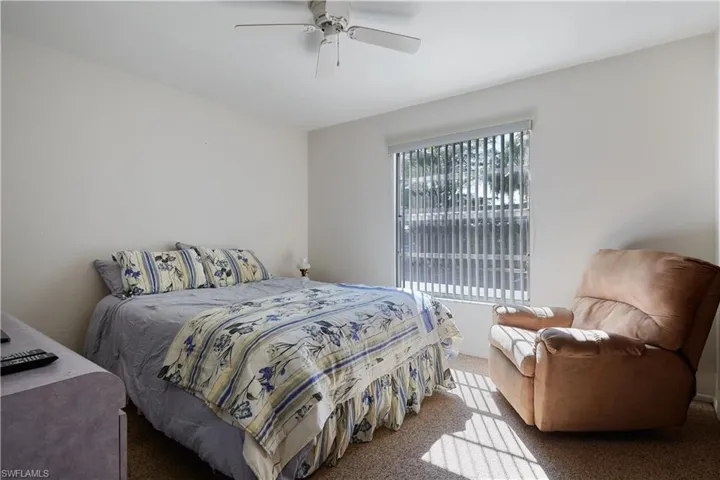 Bedroom with carpet flooring and a ceiling fan