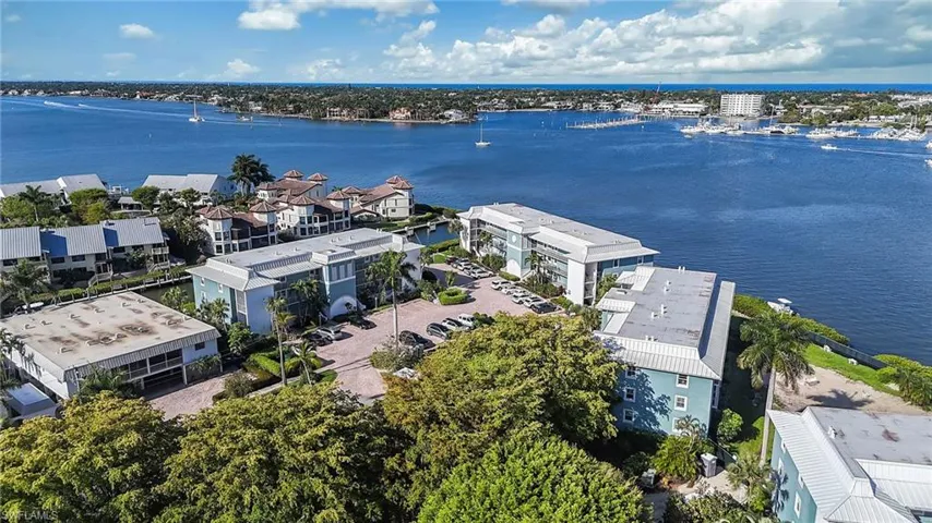 This property offers expansive water views and is situated in a vibrant waterfront community with nearby marinas