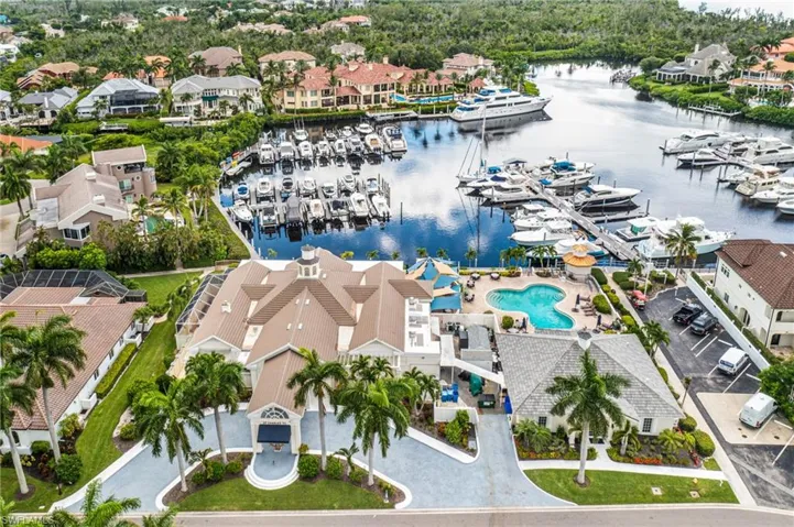 Bird's eye view of numerous boat docks and a large body of water