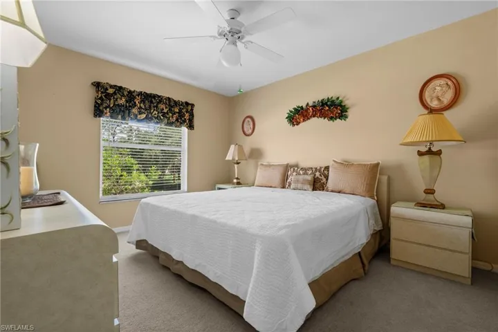 Bedroom featuring carpet flooring and a ceiling fan