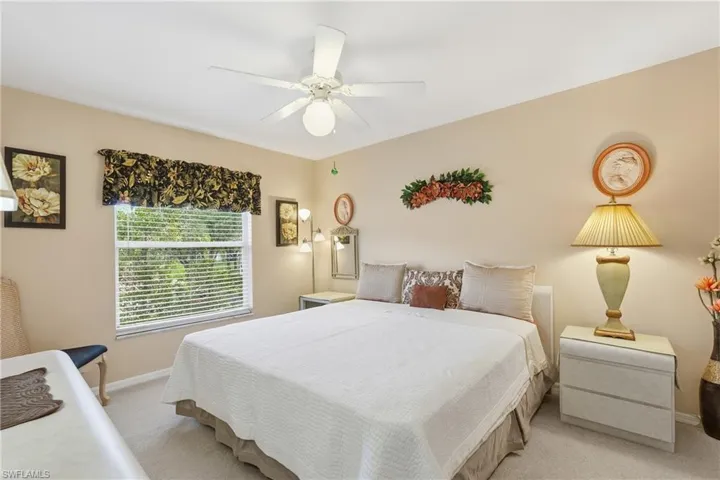 Bedroom with carpet flooring and ceiling fan