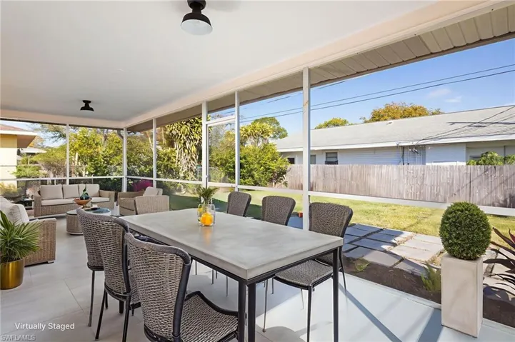 Spacious screened-in Lanai with plenty of natural light overlooking large newly landscaped back yard.