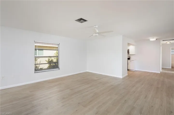 Unfurnished room featuring LVP flooring and new light/ceiling fan