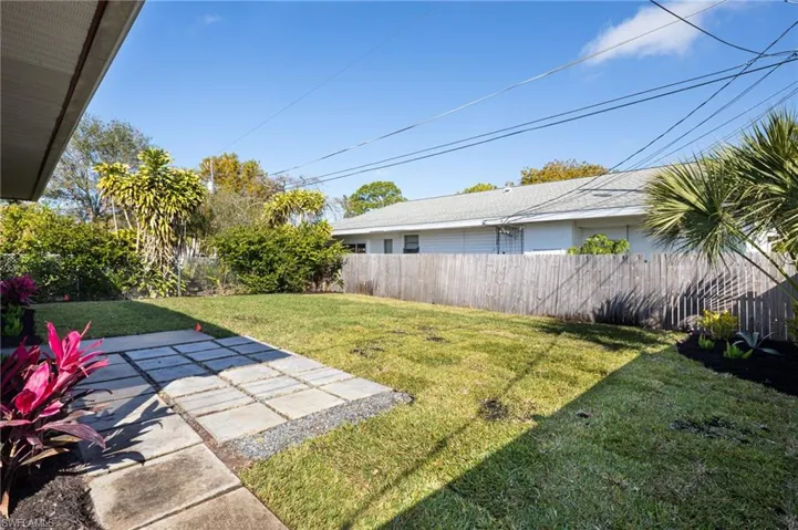 Fenced backyard with a patio area
