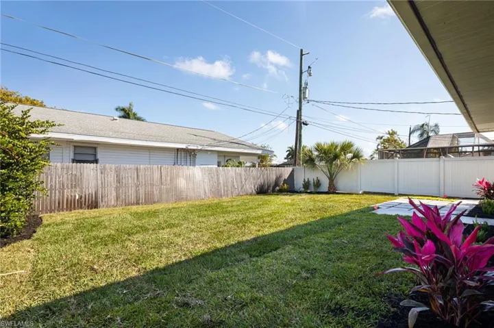 Fenced backyard with new landscaping and irrigation.
