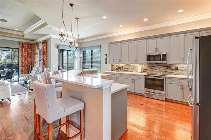 Kitchen with breakfast bar and sink