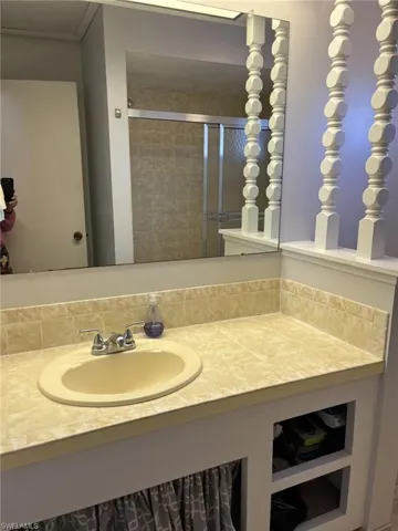 Bathroom featuring vanity and walk in shower