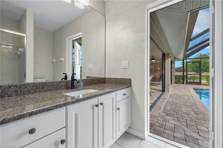 Guest bathroom with door to the lanai