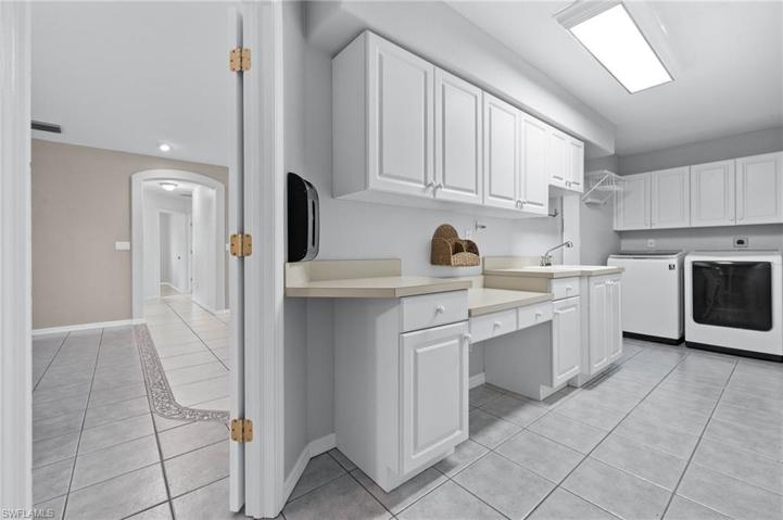 Huge laundry room with sink & storage