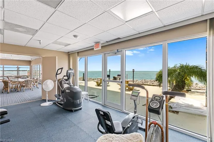An exercise room with great water view.
