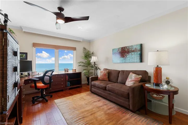 Bedroom 2 is being used as an office, it has a full closet, and wood flooring.