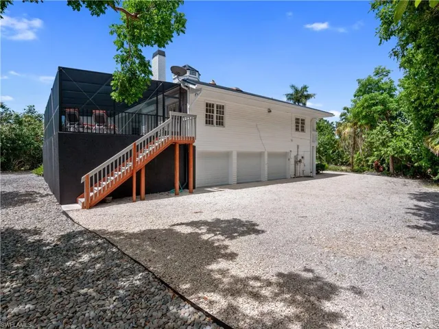 Rear view of house with a garage