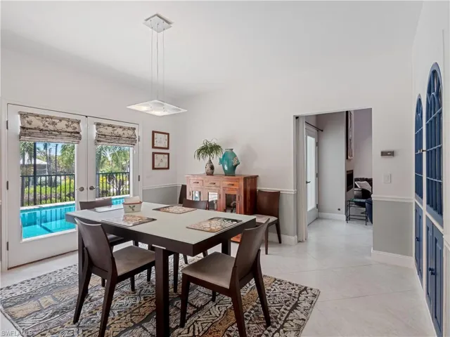 Tiled dining space with french doors
