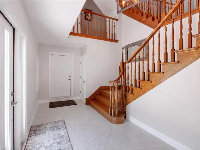 Entrance foyer with tile patterned flooring