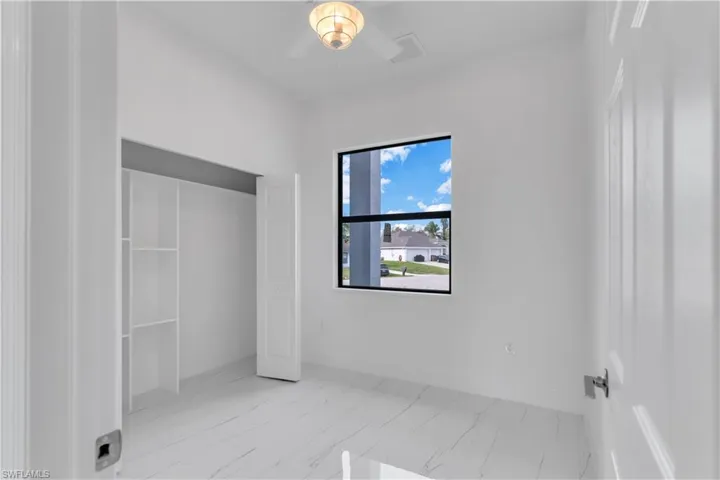 Unfurnished bedroom with ceiling fan