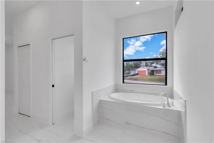 Bathroom with tiled bath