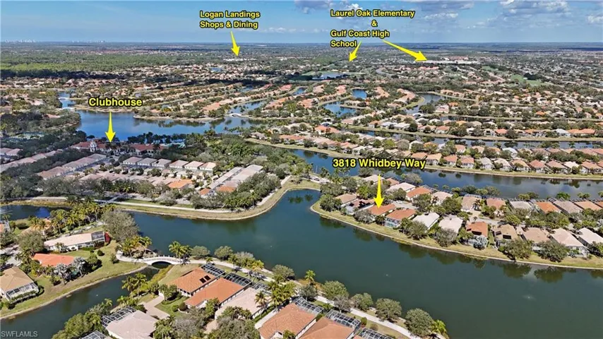 Aerial view of property and surrounding area featuring nearby suburban area