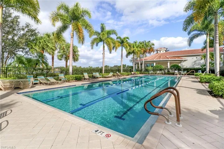 Community pool featuring a patio