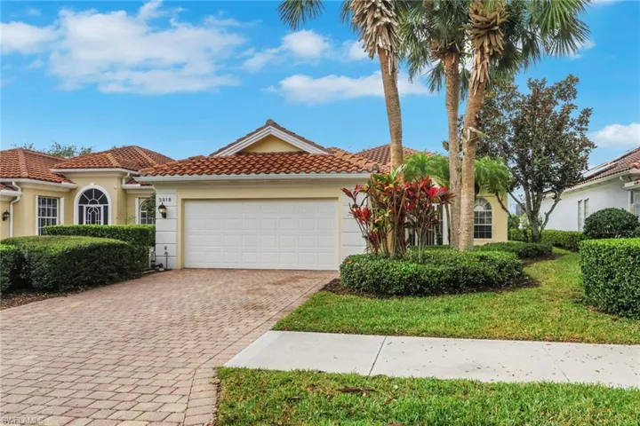 Mediterranean / spanish-style home featuring stucco siding, decorative driveway, a tile roof, and an attached garage