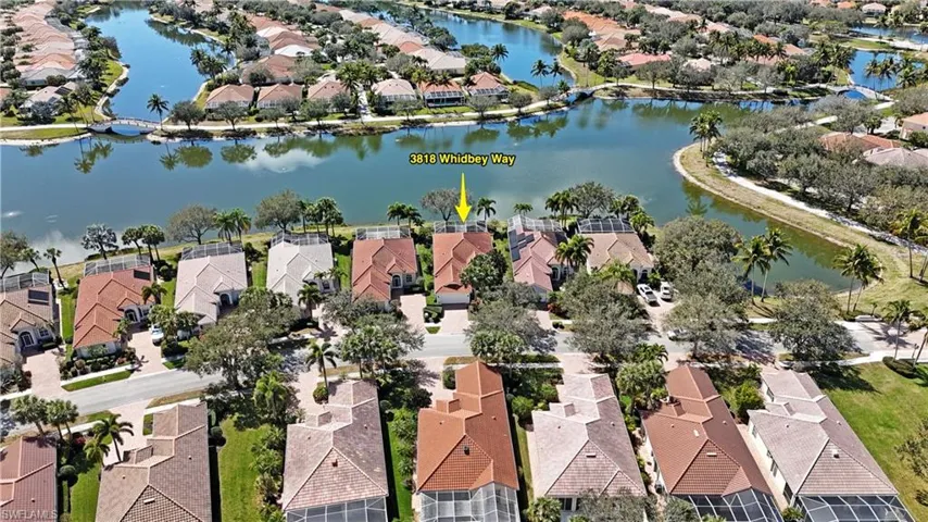 Aerial perspective of suburban area with a large body of water