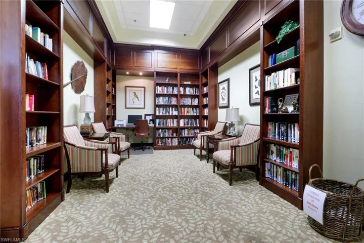 Living area featuring a desk and bookshelves