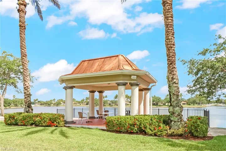 View of property's community with a patio area, a gazebo, and a water view