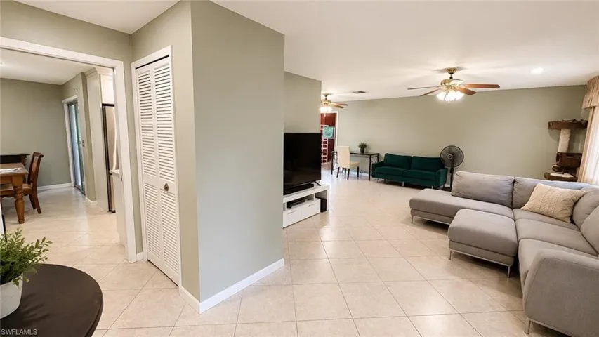 Spacious interior featuring neutral wall tones and tile flooring throughout