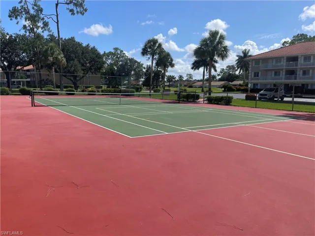 View of tennis court with community basketball court