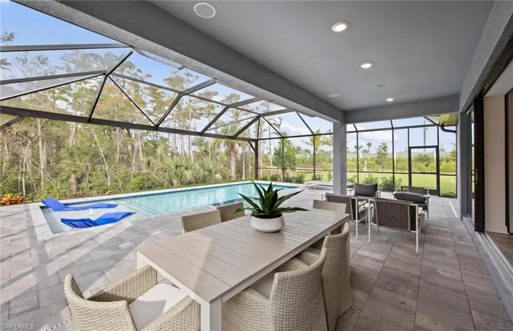 Spacious outdoor area - screened-in pool & spa