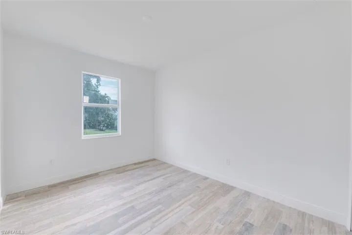 Spare room featuring light hardwood / wood-style flooring
