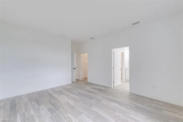 Spare room with light hardwood / wood-style floors
