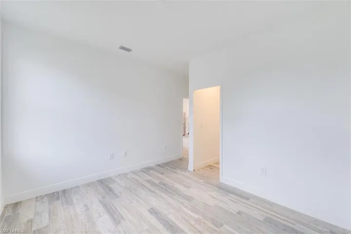 Spare room with light hardwood / wood-style floors