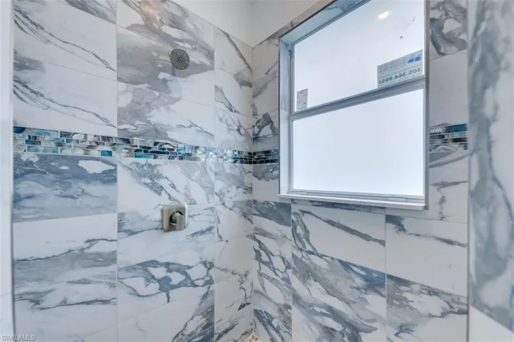 Bathroom featuring a tile shower
