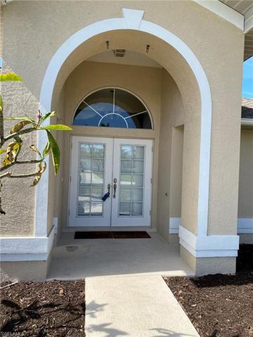 Double French door entry and arched window welcomes guests and friends!