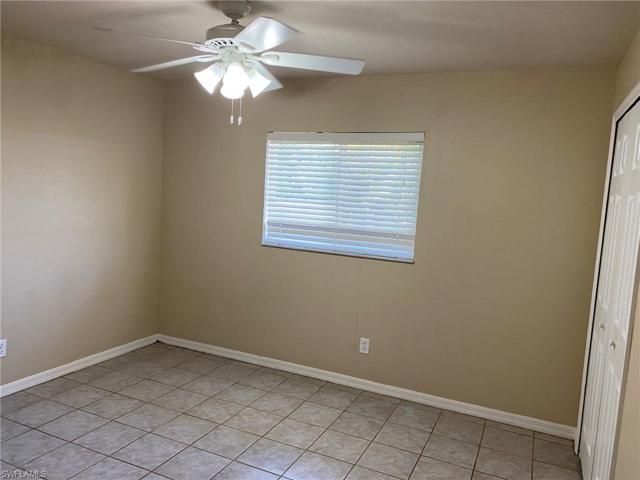 The rear Guest Bedroom also features tiled flooring, large window, ceiling fan and ample closet.