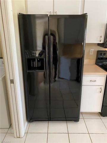 Side by side refrigerator with ice and water in the door.