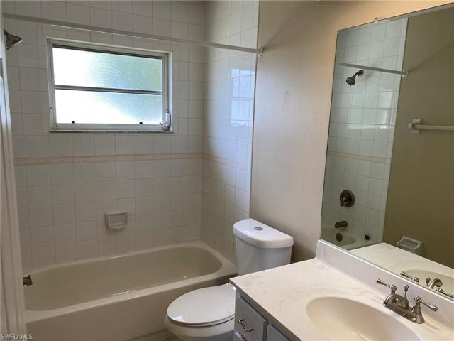 Guest Bath has a tiled combination tub/shower and Linen closet.