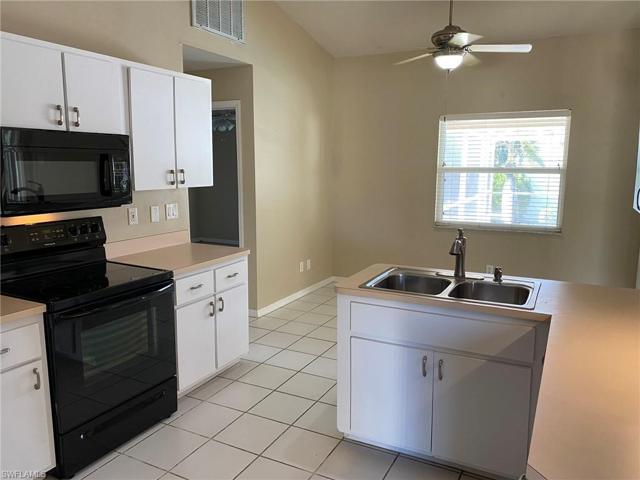 The vaulted ceiling gives the Kitchen and Breakfast room an open feeling and overlooks the pool area
