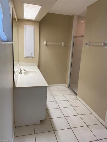 The Master Bath features large vanity, walk in tiled shower and hall Linen closet.