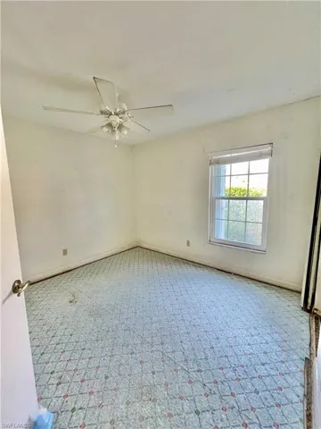 Unfurnished room featuring ceiling fan